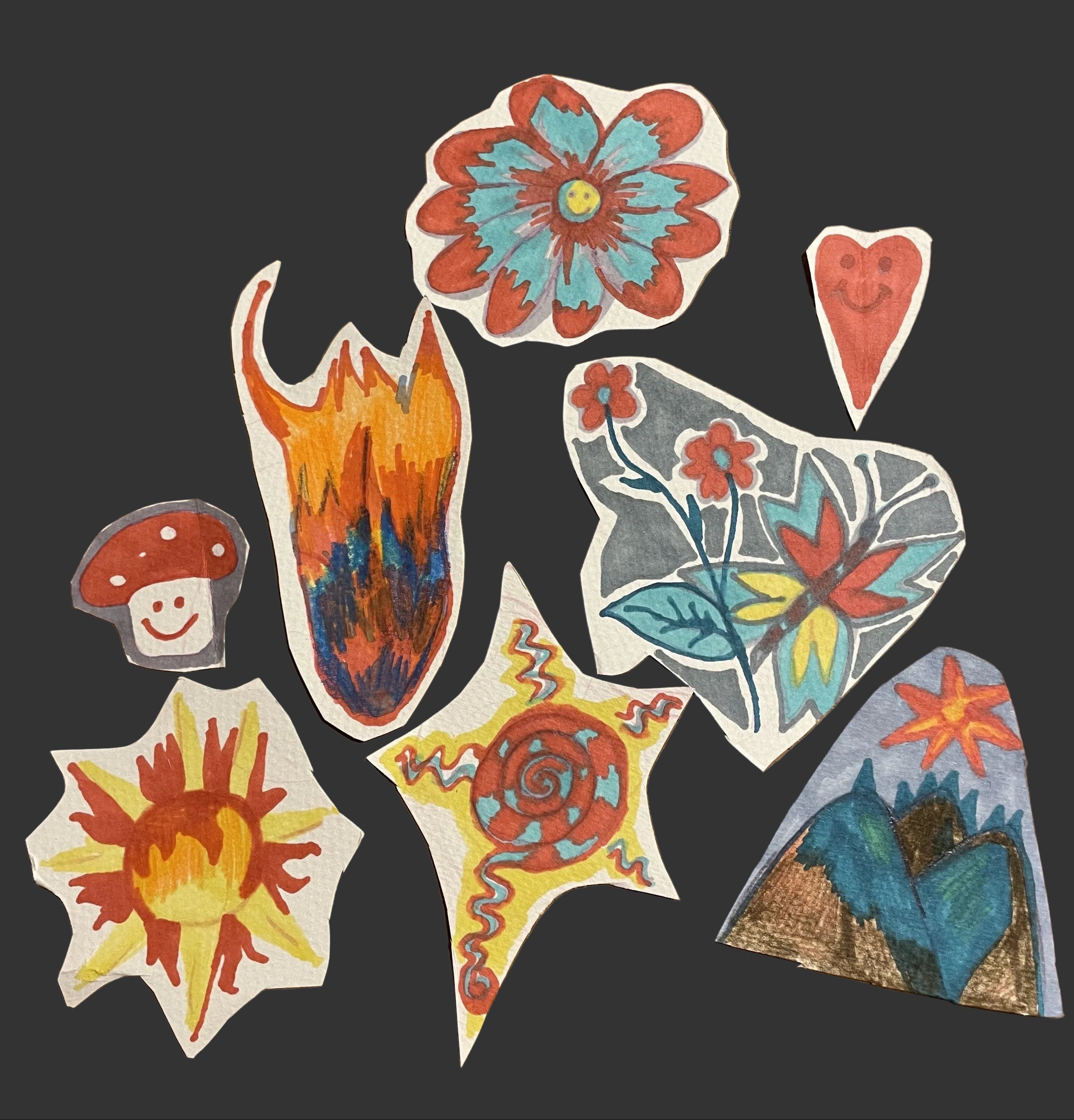 Colorful paper cutouts of various shapes and designs on a wooden surface